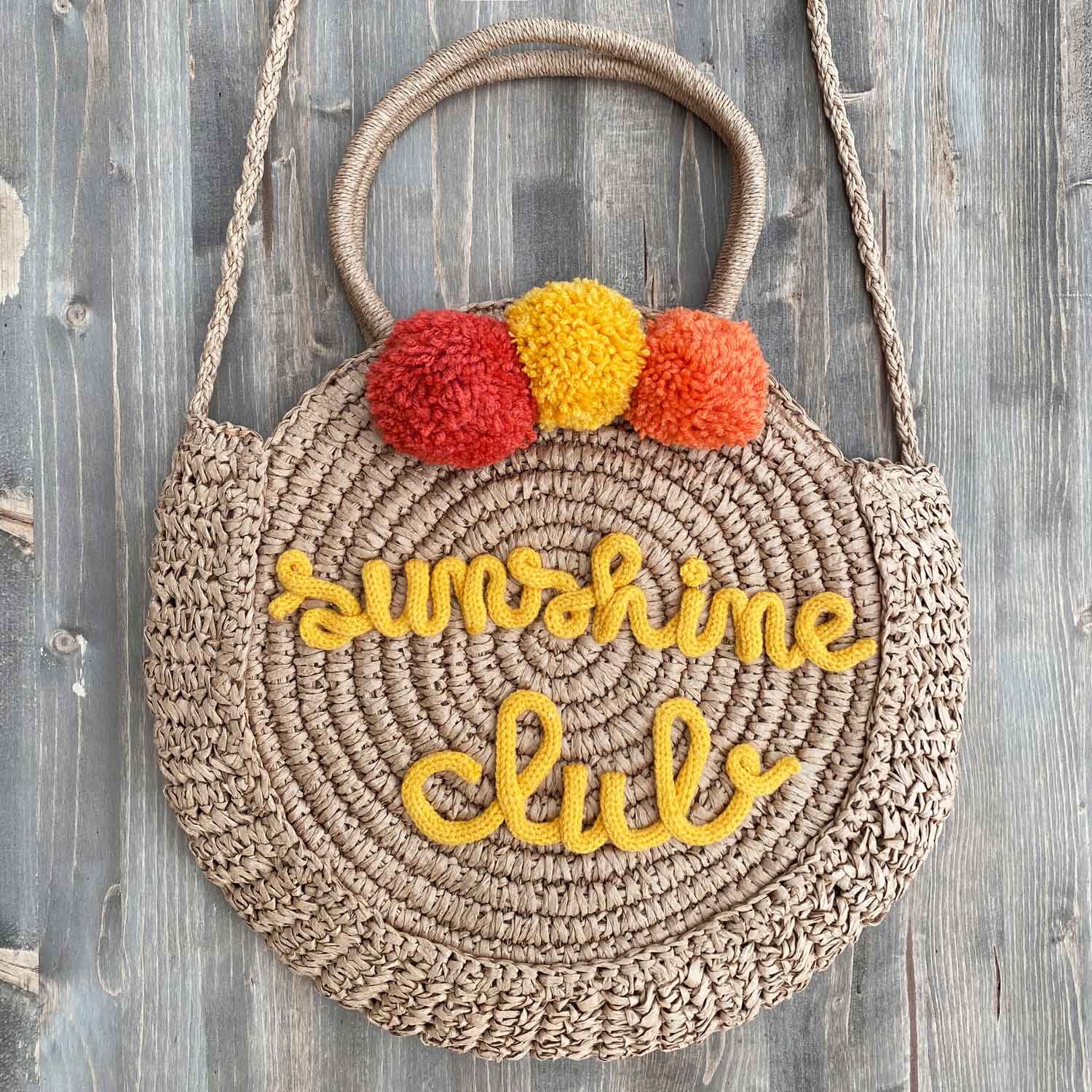 Borsa in paglia rotonda con scritta personalizzata