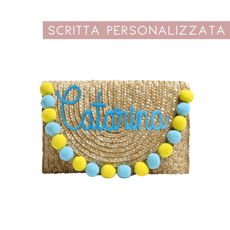 Pochette in paglia Ibiza con scritta personalizzata e pon pom gialli/azzurri