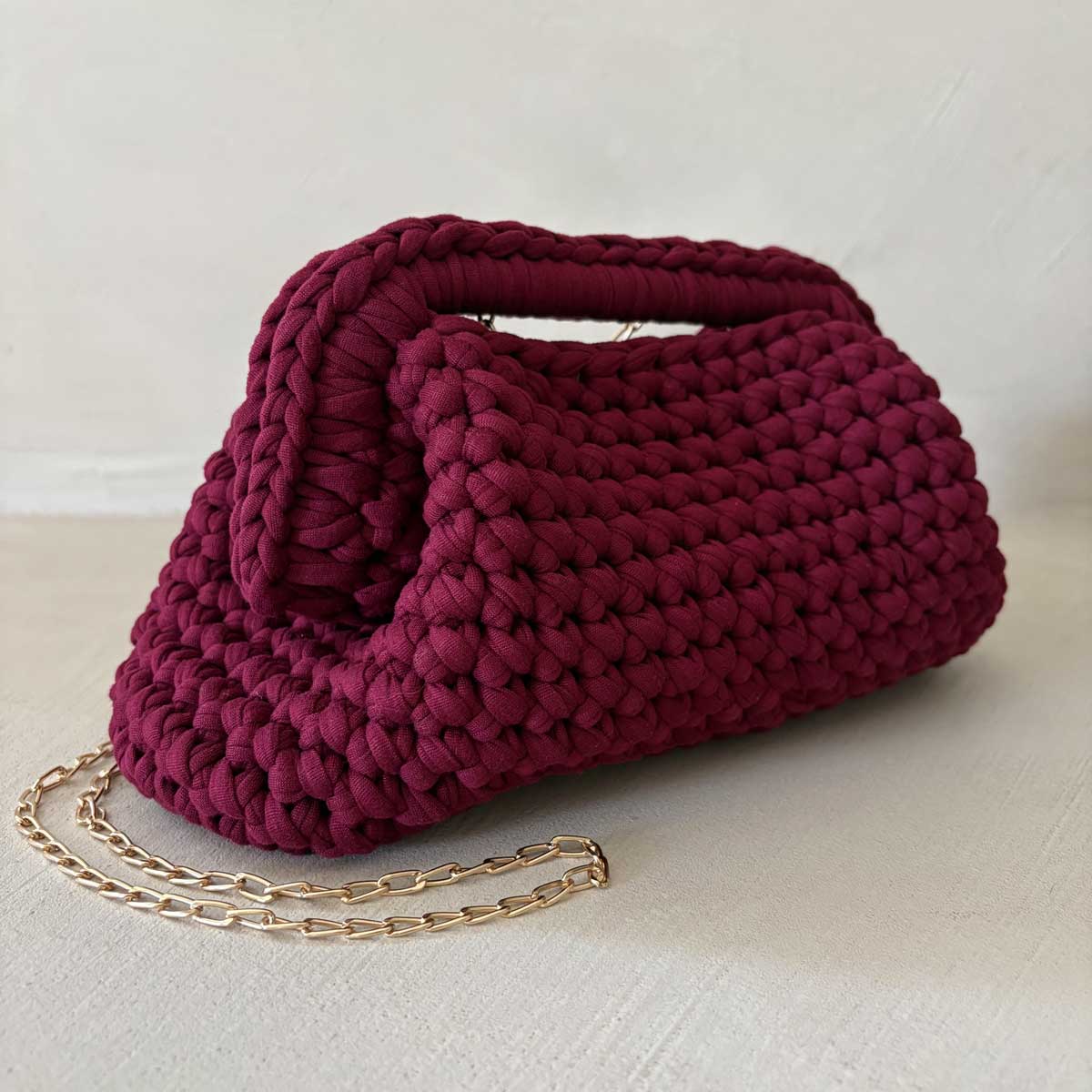 Clutch all'uncinetto in lycra bordeaux