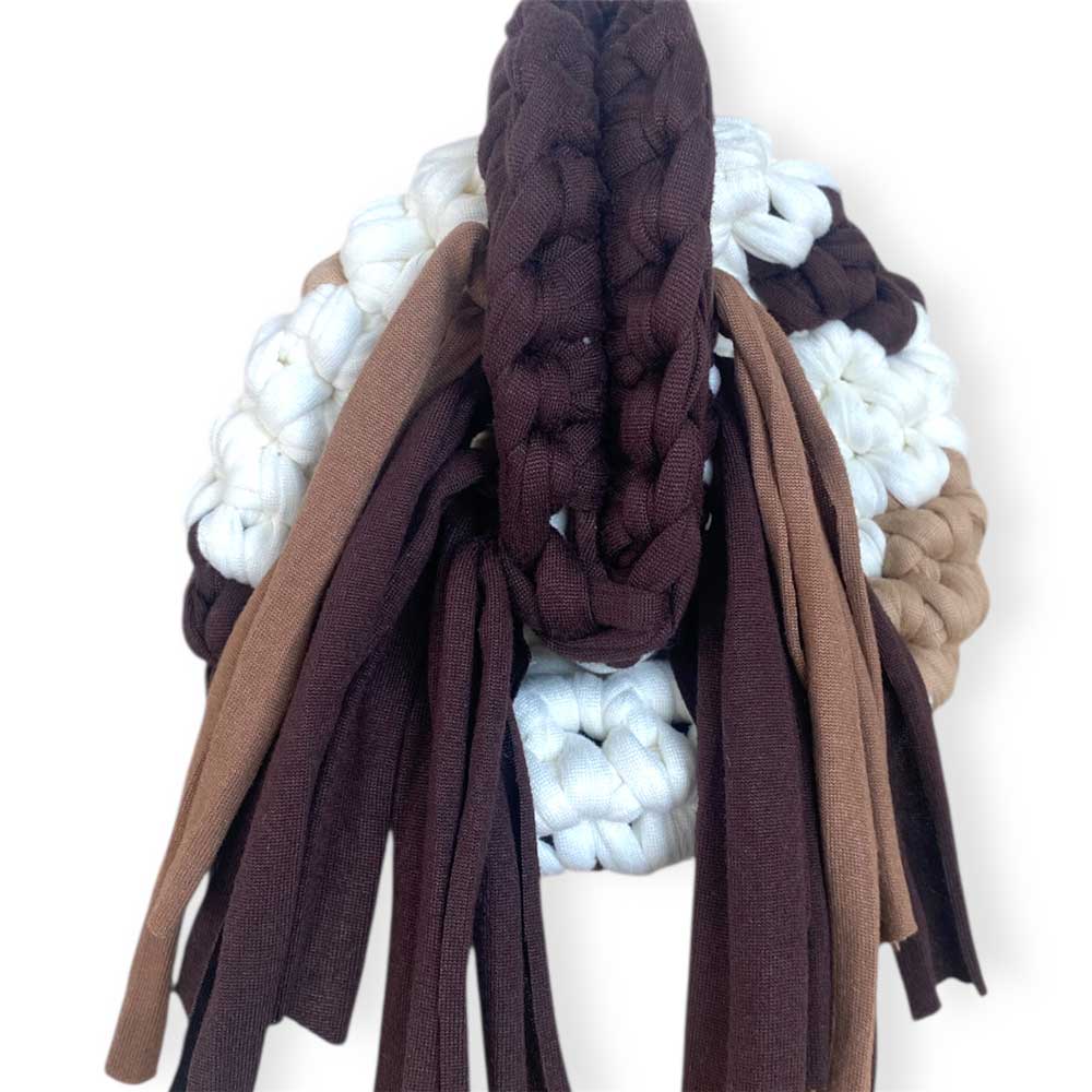 Borsa clutch all'uncinetto fantasia muccata cow print